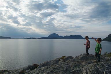 Late walk on Norway fjord coastal cliffs.