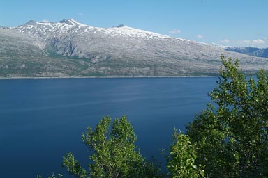 Snow covered mountains, fjord.