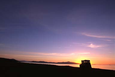 Sunrise behind Land Rover