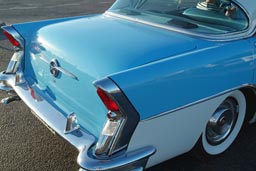 Bigmeet rear turquoise Buick.