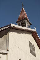 Gustave Eiffel church clock tower, colored windows on white painted metal, Santa Rosalia, Baja California Sur. 