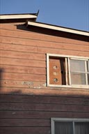 Speakers in window, wooden house, Santa Rosalia.