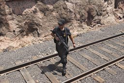 Police and machine guns guarding Chepe train.