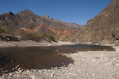 Red and warm colors of Urique Canyon and River.