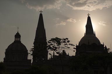 Cathedral, Guadalacara, silhuette of towers and cupola against setting sun.