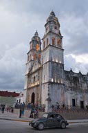 Evening comes, Campeche Cathedral and black VW bug.