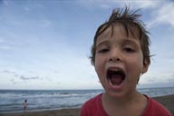 David, cloudy sky, his face, mouth wide open, shouting.