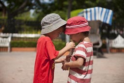 Ciudad Carmen, boys share a drink.