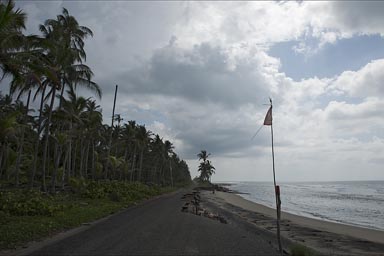 Road washed away by sea. Laguna del Carmen.