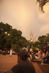 Merida, Yucatan, People gather on main Cathedral Square at dusk.