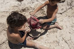 Or how abut this? Fill sand in hats? Twin boys Daniel and David fill sand in their hats on Colorada Beach near Rio Lagartos, Yucatan.