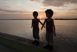 Boys inspect the pier. Rio Lagartos, Yucatan.