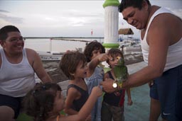 So nice people, nice little parrot. Mexicans in Rio Lagartos.