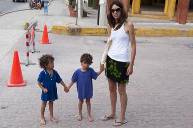 Playa del Carmen, C. arrives. Boys no shoes.