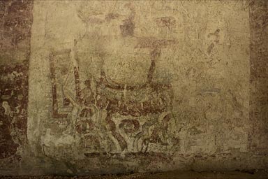 Painted Maya mural in XelHa. Figure wearing bracelet.