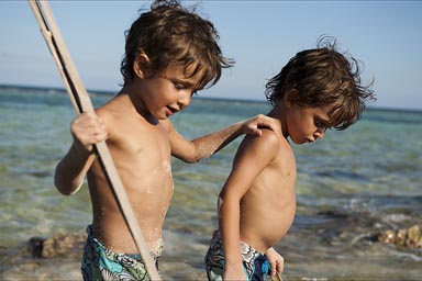 Looking for crabs with a stick.