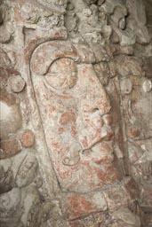 About 500 A.D. the masks are well preserved, reddish taint, 2 meter high faces of stone, Maya Kohunlich, Yucatan peninusla, Mexico.