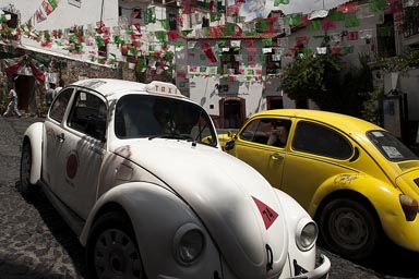 Yellow and white Vochito. Volkswagen beetles in Taxco, Mexico.