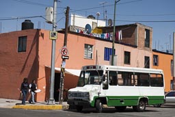 Bus and orange house, Mexico City.