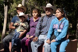 Mexican family posing for picture.