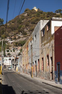 Street Atlixco, church on hill.