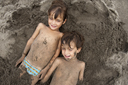 Buried on sandy Pacific Ocean beach.