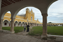 Izamal, Yucatan. Priest walking over atrium, Franciscan convent.