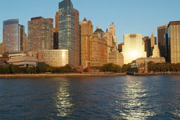 Sun is reflecting in office buidings, and Hudson River, Downtown Manhatten, NY.