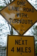 Roadsign turned sieve, bullet holes from shooting excercise.