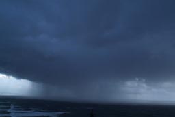 Dark cloud over Pacific Ocean.