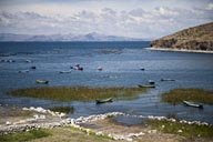 Boats, fish farming, reed on Lake Titicaca, Peru.