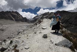 An idigenous woman on her way up to the refuge on 5,250m. Huayna Petosi, Bolivia. 