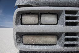 Salt crust over lights of van on Salaraes de Uyuni.