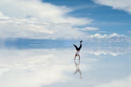 Jean and hand stand on Uyuni Salare.