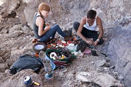 Cat and Jean preparing a second round of the world famous salare sandwich, on Fish Island, Salare de Uyuni, Bolivia. 