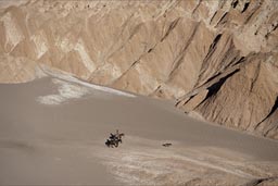 Riders, horses in valley de muertos, San Pedro Atacama.