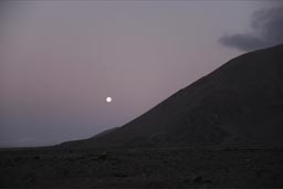 The full moon behind Morro Moreno, near Antofagasta, Chile.