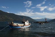 Fishing boat and light tower of Bahia Cochamo.