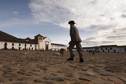 Colombia on Gabriel Garcia Marquez tracks from Cartagena, Barranquilla, Santa Marta, Guajira, Riohacha, Maicao, Bucaramanga, Pamplona, Yinjo, Villa de Leyva, Boyaca Bridge, Bogota. Man and hat on main square of Villa de Leyva, Colombia.