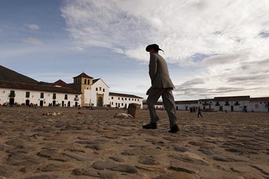 Man and hat on main square of Villa de Leyva, Colombia.