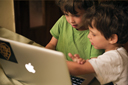 Twin boys, Daniel and David, 5, learning computer.