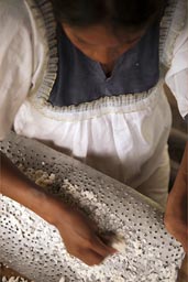 Grating of yuca on a sharp holed metal. Woman grates yuca, Ecuador, Cuyabeno.