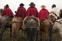 Five riders in ponchos. The Ecuadorian Andean mountains.