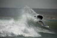 Surfer turns in a wave, Lobitos beach, Peru.