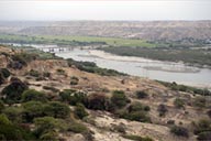 Bridge over Chira River in desert valley. Cotton sugar cane and rice is cultivated on its banks.