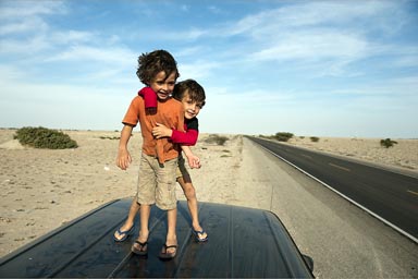 My boys, top of van, Pan Americana, Sechura desert, Northern Peru.