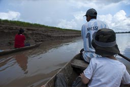 On Huallaga river up-stream we go in two canoes. Peru, Amazon rainforest.