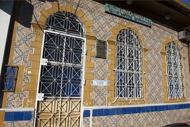 Epoche beauty of past years reflected in sunlight, Cauchero architecture, Iquitos, Peru. Yellow tiled house.