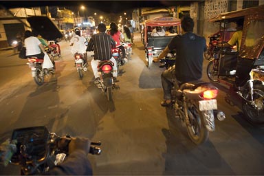 Nightly auto rickshaw, motor cycle taxi ride home, Iquitos Peru.