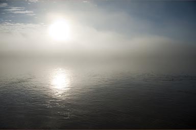 Sun through haze of early morning Huallaga River.